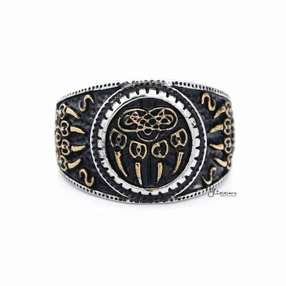 Two-tone stainless steel men's ring with gold claws on a black circular background, featuring a sleek and modern design.