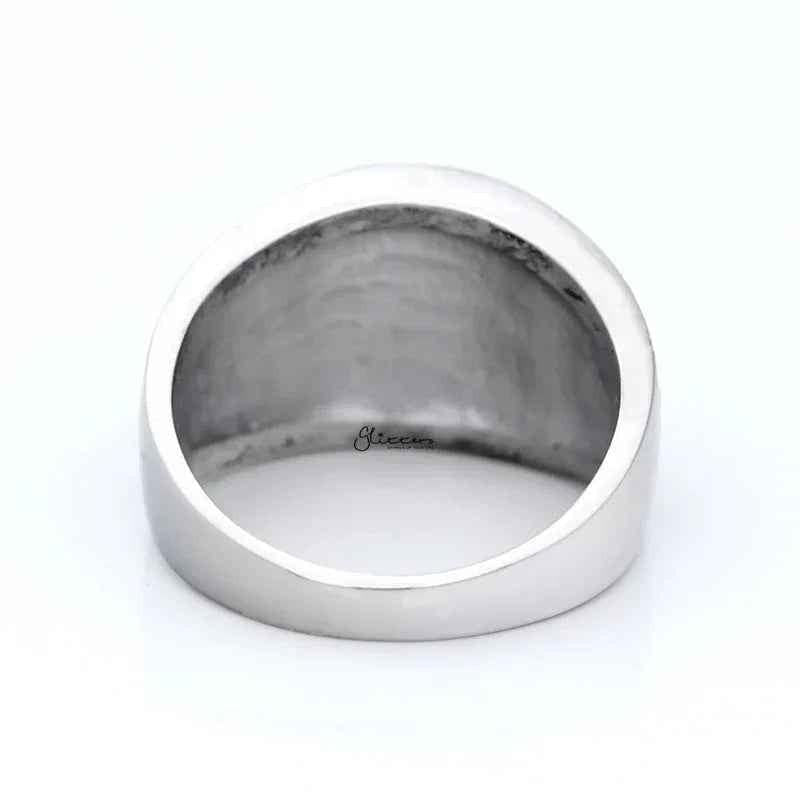Two-tone stainless steel men's ring with gold claws on a black circle, featuring a bold and modern design.