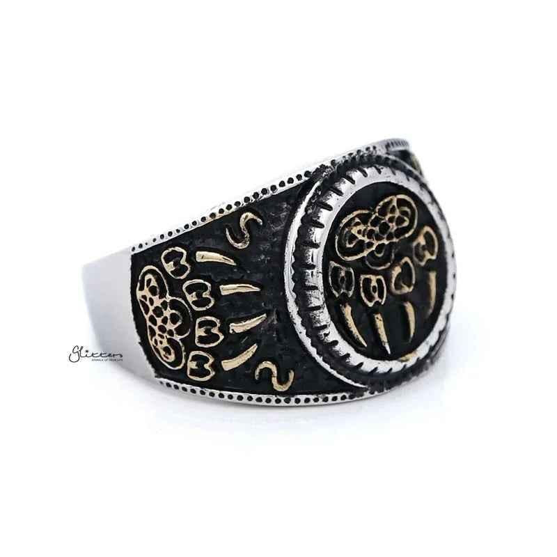 Stainless steel men's ring by Glitters featuring gold claws on a black circle with two-tone finish.