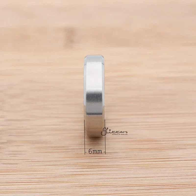 Silver stainless steel 6mm wide beveled edge band ring from Glitters, showcasing a sleek, modern design.