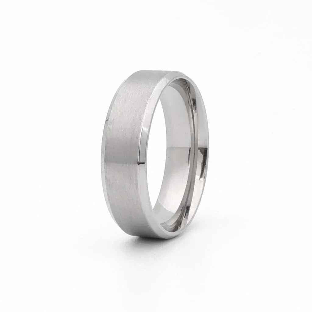 Stainless steel 8mm wide beveled edge band ring by Glitters, showcasing a sleek, polished design on a plain background.