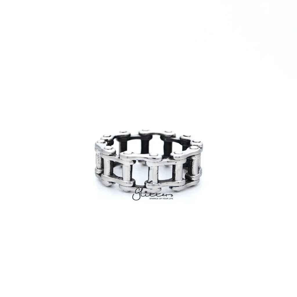 Stainless steel men's ring with antiqued motorcycle chain casting design by Glitters, showcasing rugged and detailed craftsmanship.