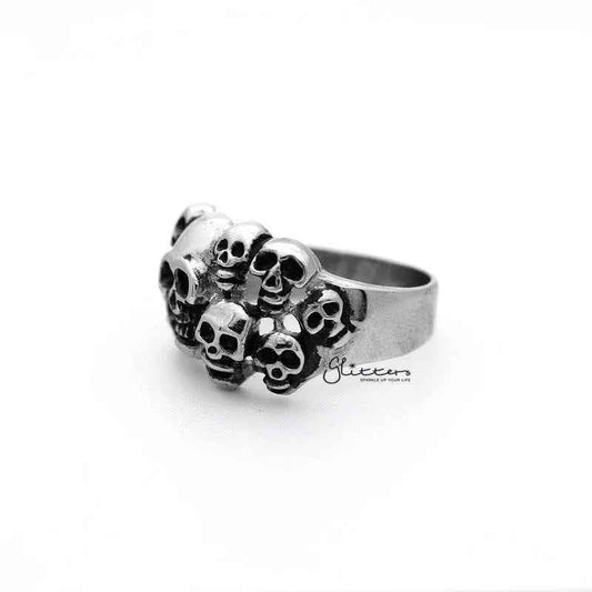 Stainless steel men's ring featuring antiqued multi skull head design by Glitters, with a bold, detailed casting style.