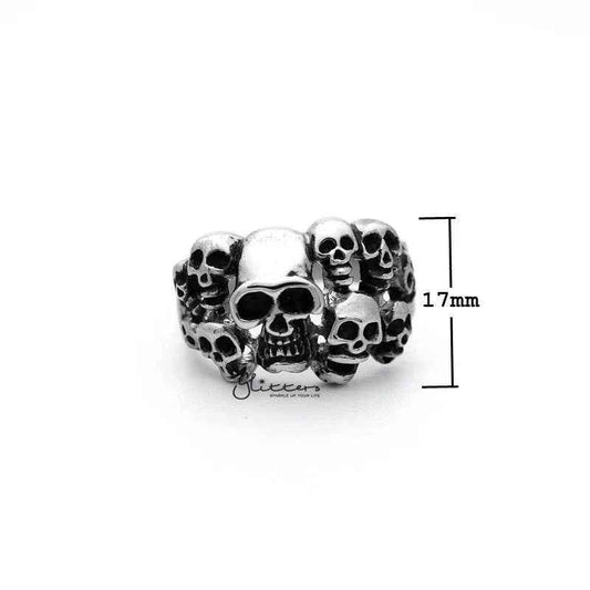Stainless steel men's ring by Glitters featuring an antiqued finish with multiple skull head designs and detailed casting.