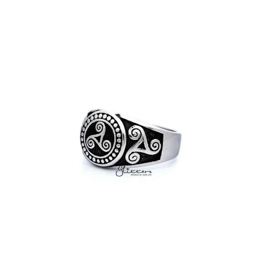 Stainless steel men's ring with antiqued triskele and triple spiral design, cast by Glitters.