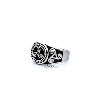 Stainless steel men's ring with antiqued triskele and triple spiral design, cast by Glitters.