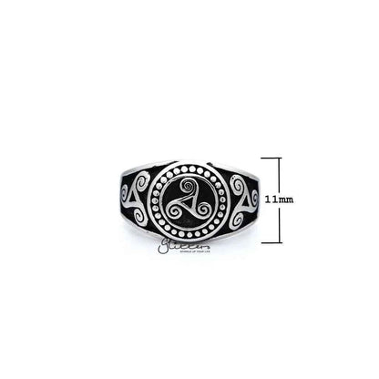 Stainless steel men's ring with antiqued triskele and triple spiral design, cast by Glitters, showcasing intricate metalwork and craftsmanship.