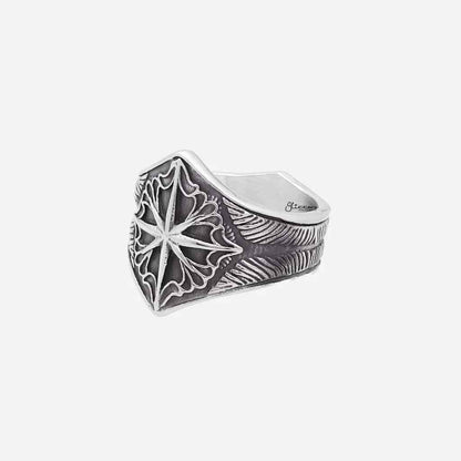 Stainless steel compass ring by Glitters featuring a detailed compass design on a sleek band.