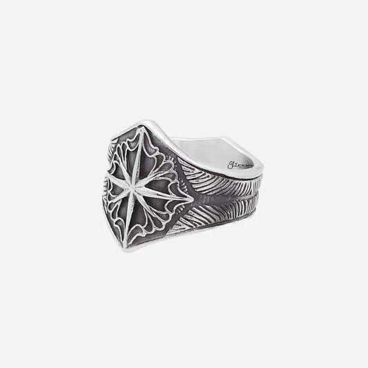 Stainless steel compass ring by Glitters featuring a detailed compass design on a sleek band.