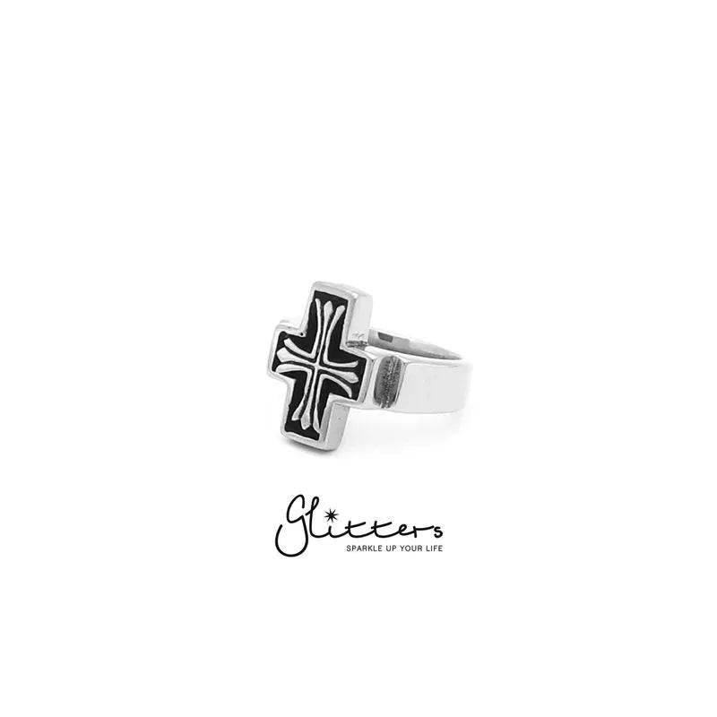 Stainless steel cross cast ring by Glitters featuring a detailed cross design on a smooth band.