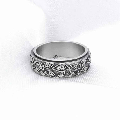 Silver stainless steel Eye of God spinner ring by Glitters, featuring a detailed eye design and smooth band.