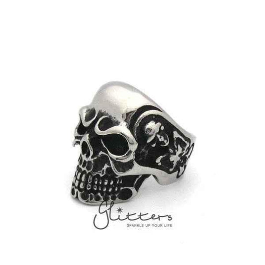Stainless steel Gothic skull cast men's ring from Glitters featuring a detailed skull design on a sleek band.