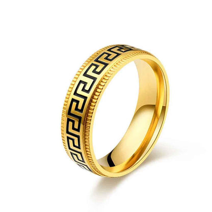 Gold stainless steel Greek key pattern band ring from Glitters, featuring intricate geometric design and smooth polished finish.