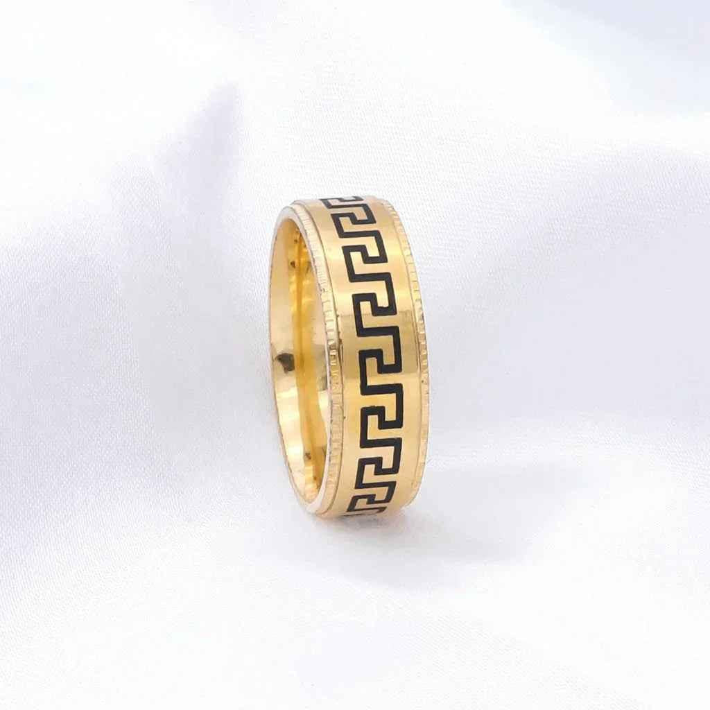 Gold stainless steel Greek key pattern band ring by Glitters, showcasing an elegant, polished design on a sleek ring.