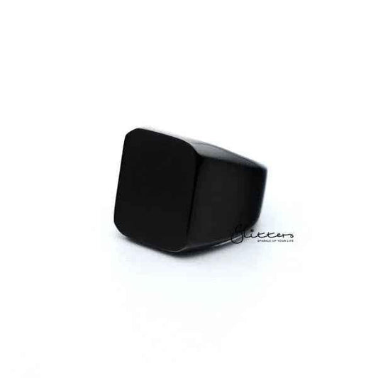 Black stainless steel men's ring with high polished square shape from Glitters, showcasing a sleek, modern design.