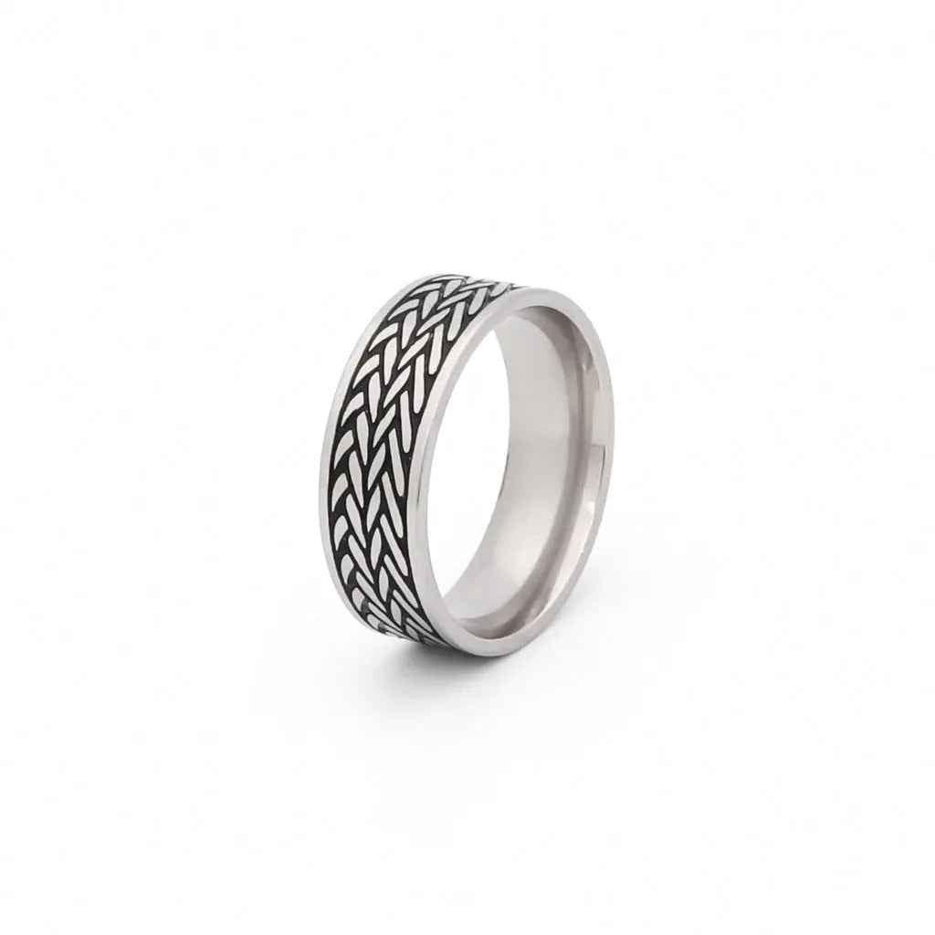 Stainless steel leaf pattern band ring by Glitters featuring detailed engraved leaf design on a smooth band.