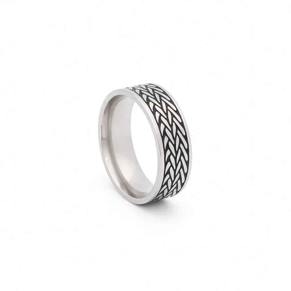 Stainless steel leaf pattern band ring by Glitters, featuring a detailed leaf design on a sleek stainless steel ring.