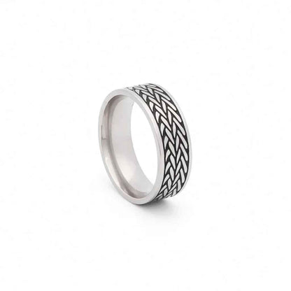 Stainless steel leaf pattern band ring by Glitters, featuring a detailed leaf design on a sleek stainless steel ring.