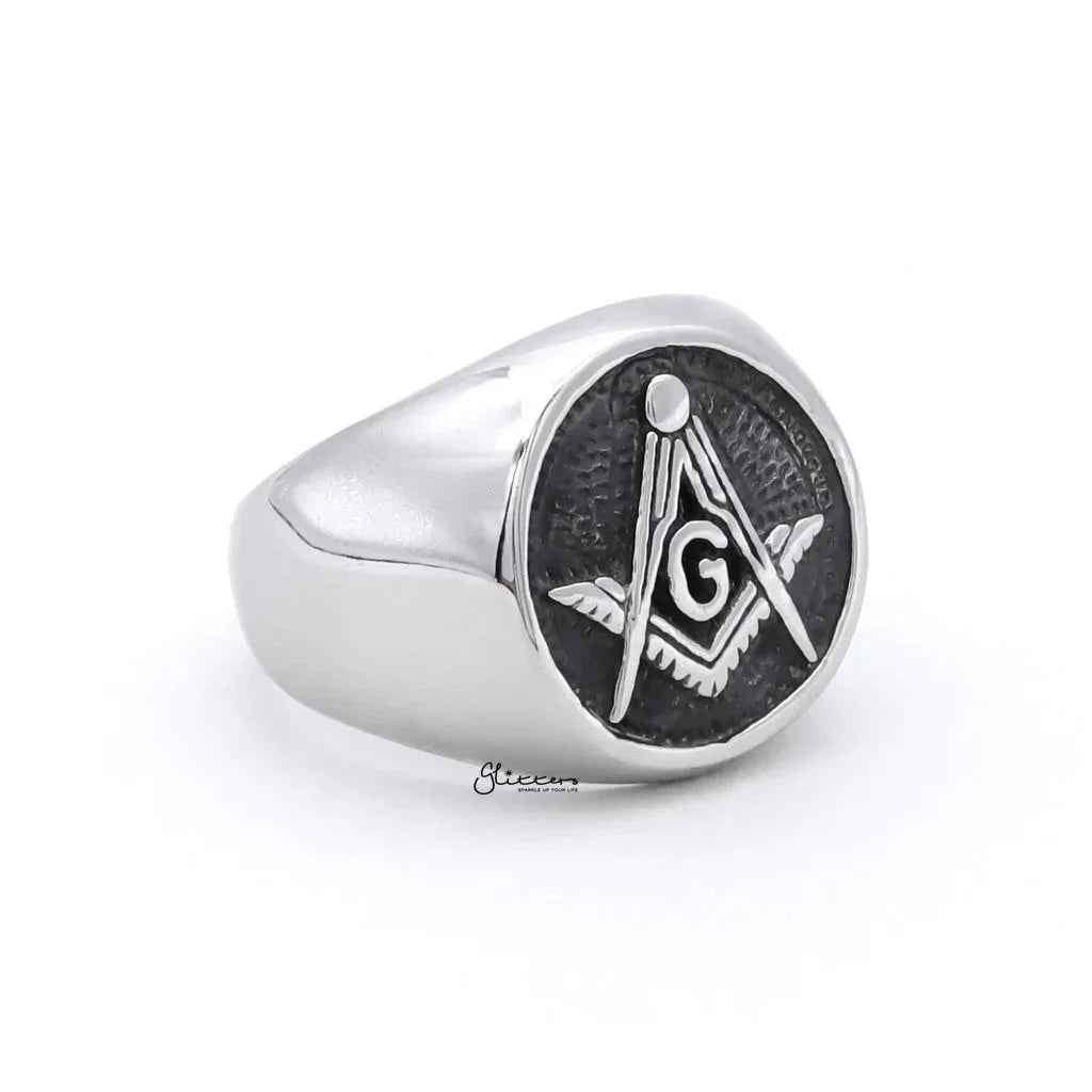 Stainless steel Masonic ring with engraved symbols, designed by Glitters, showcasing detailed craftsmanship and a polished finish.