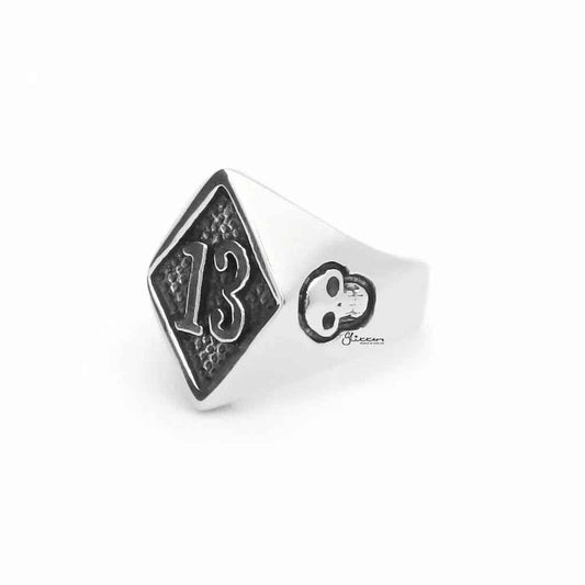 Stainless steel number 13 and skulls ring by Glitters featuring a bold design with engraved numbers and skull motifs.