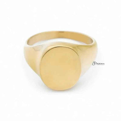 Gold stainless steel oval signet blank ring by Glitters, plain and smooth, showcasing a polished oval design on a reflective band.
