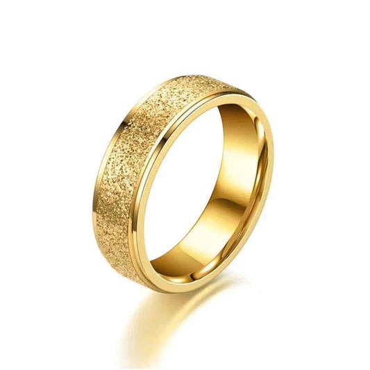 Gold stainless steel band ring with a sandblasted finish by Glitters, showcasing a sleek, matte textured design.