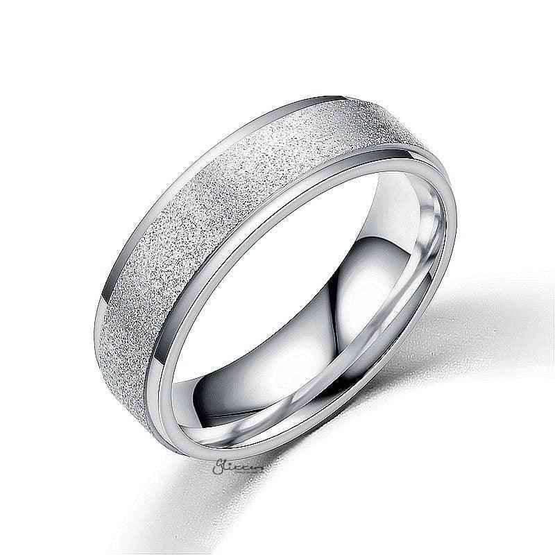 Silver stainless steel band ring with a sandblasted finish, featuring a sleek, matte surface and smooth rounded edges.