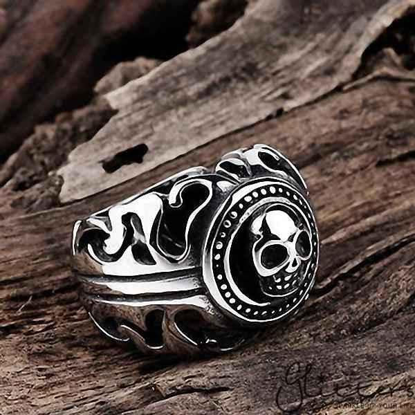 Stainless steel skull cast ring by Glitters featuring a detailed skull design on a polished stainless steel band.