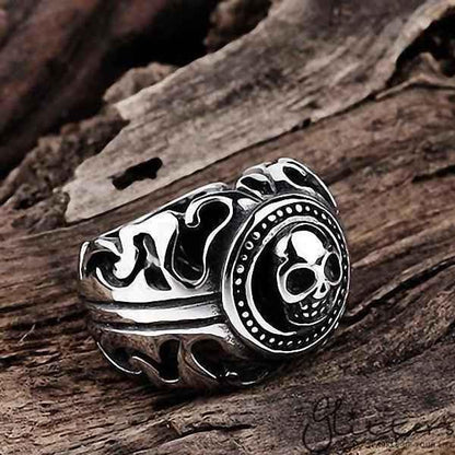 Stainless steel skull cast ring by Glitters featuring a detailed skull design on a polished stainless steel band.