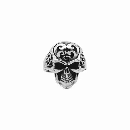 Stainless steel skull ring with tribal carved design, featuring detailed skull and tribal patterns, by Glitters.