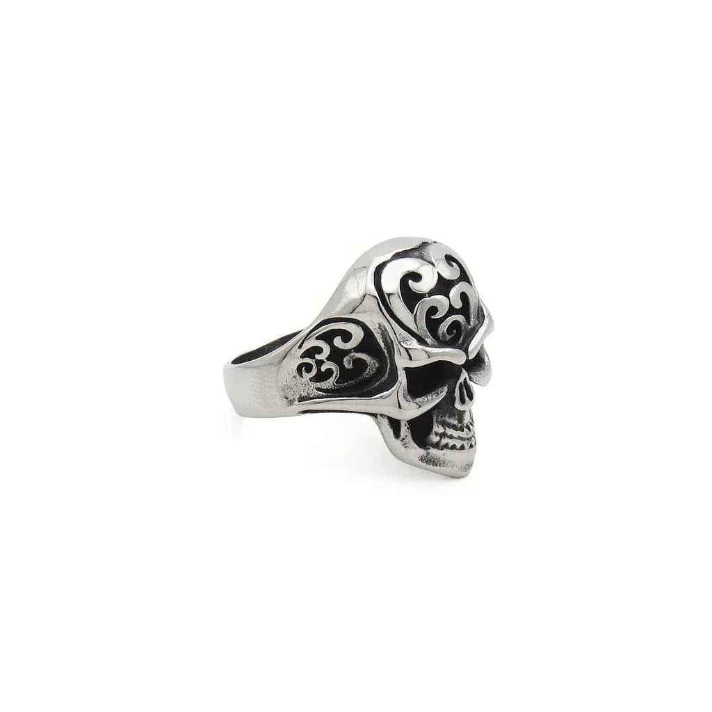 Stainless steel skull ring with tribal carved design, featuring detailed skull and tribal patterns, by Glitters.