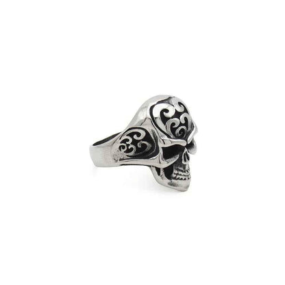 Stainless steel skull ring with tribal carved design, featuring detailed skull and tribal patterns, by Glitters.