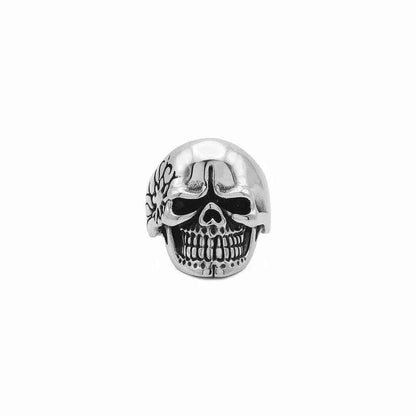 Stainless steel skull ring with tribal pattern, featuring detailed engravings and a bold, edgy design by Glitters.
