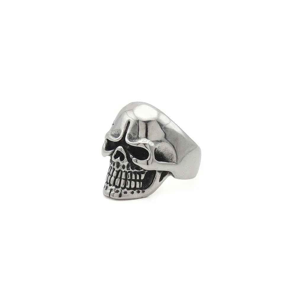 Stainless steel skull ring with tribal pattern from Glitters, showcasing detailed design and polished finish.