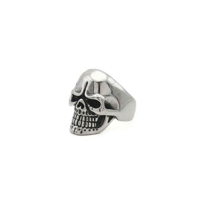 Stainless steel skull ring with tribal pattern from Glitters, showcasing detailed design and polished finish.