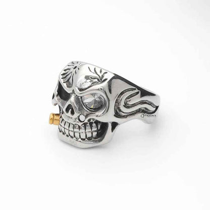 Stainless steel skull ring with gold bullet detail from Glitters, featuring a detailed skull design and metallic finish.