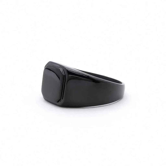 Black stainless steel square flat top signet ring by Glitters, showcasing a sleek, modern design with a polished finish.