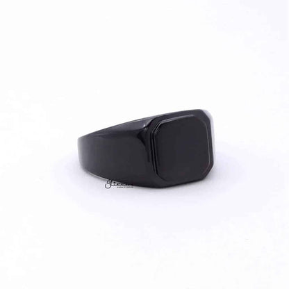 Black stainless steel square flat top signet ring by Glitters, showcasing a sleek, modern design with a polished finish.