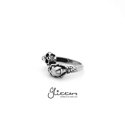 Stainless steel ring by Glitters featuring two skull heads and a dragon claw design, detailed and bold accessory for men.