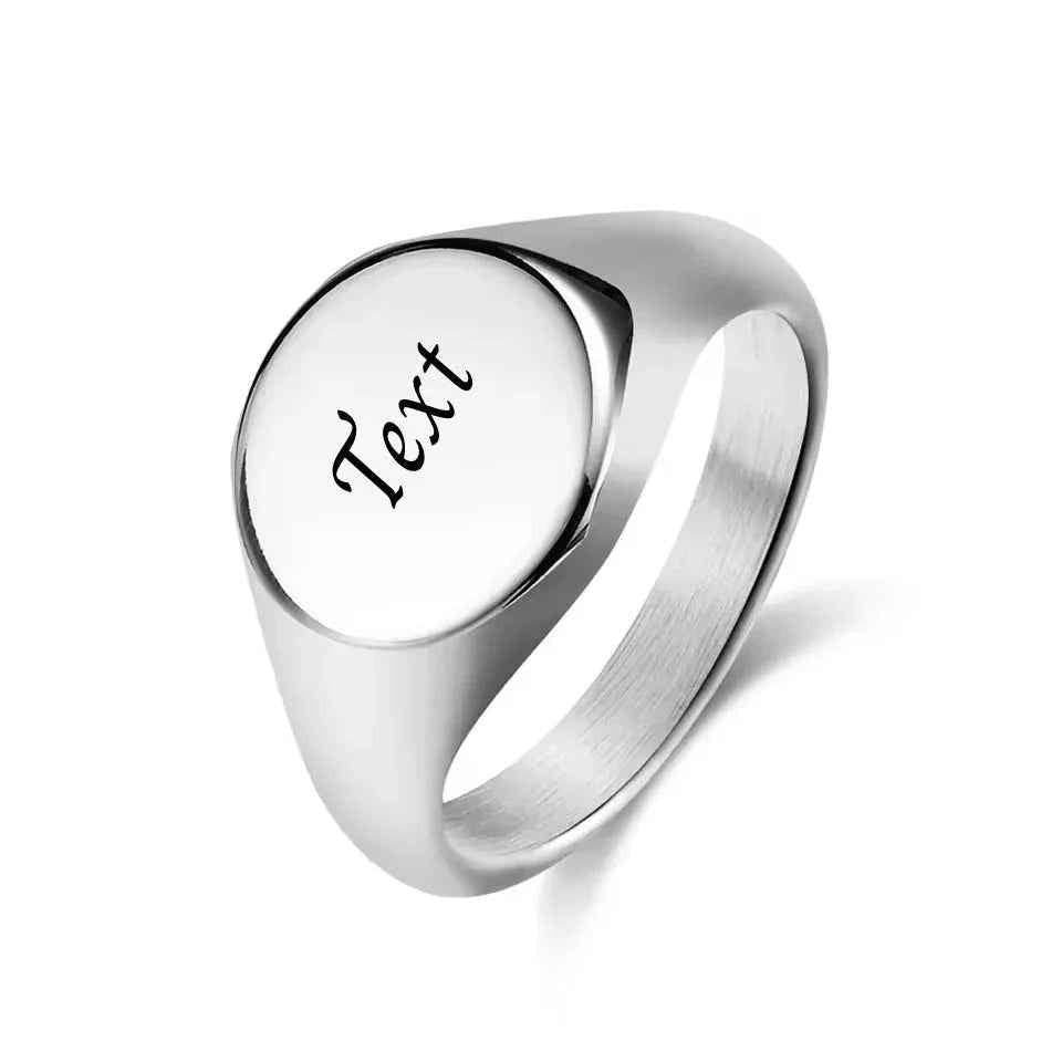 Personalised silver stainless steel round signet ring from Glitters, showcasing a polished, customizable design.