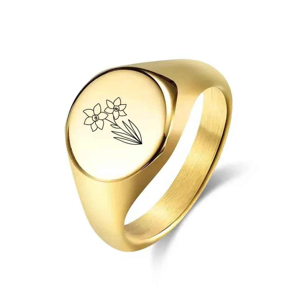 Personalised silver stainless steel round signet ring by Glitters, featuring a smooth, polished design with customizable engraving.
