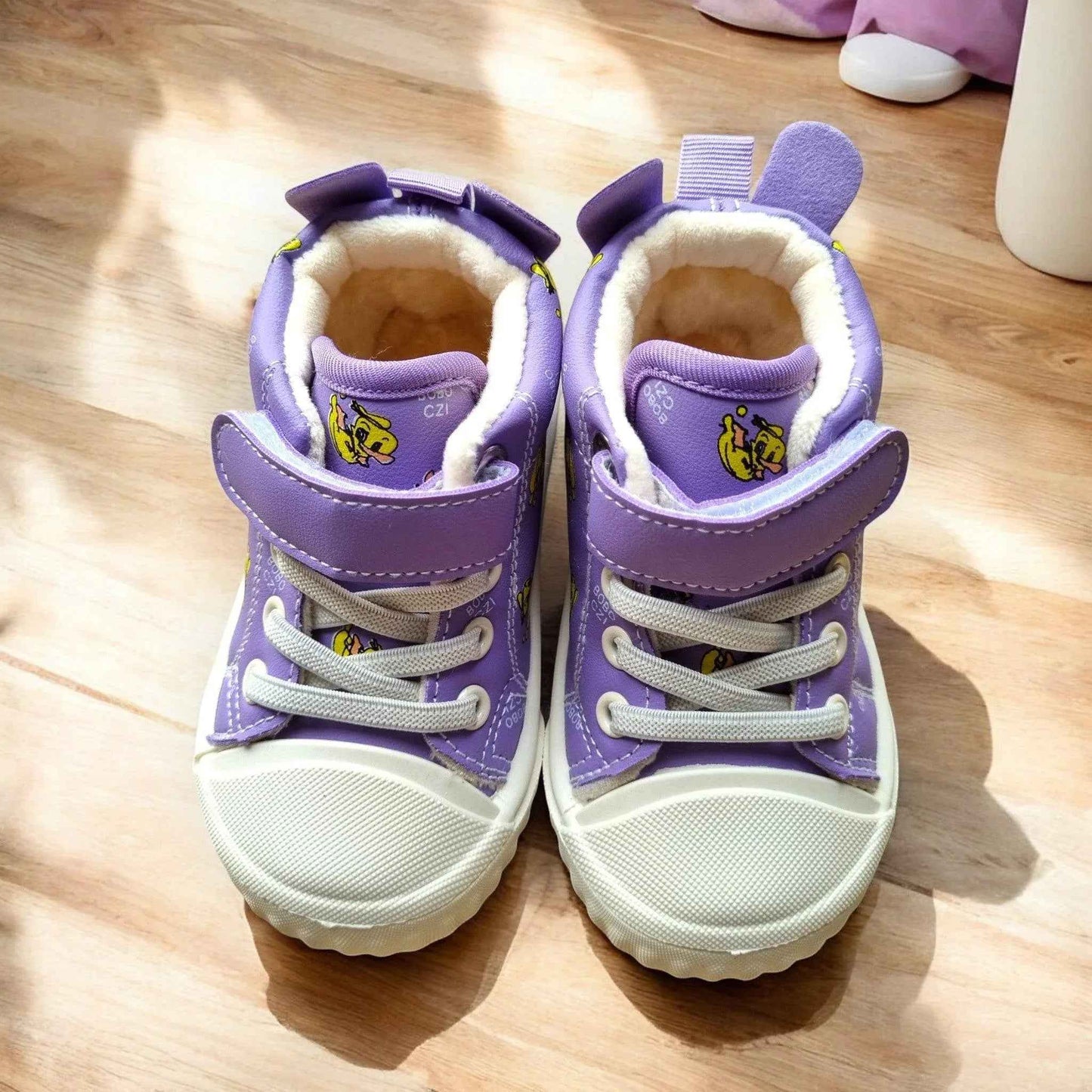 Happy Feet NZ plush high-tops in soft fabric with secure fit, designed for playful comfort and style in children's footwear.
