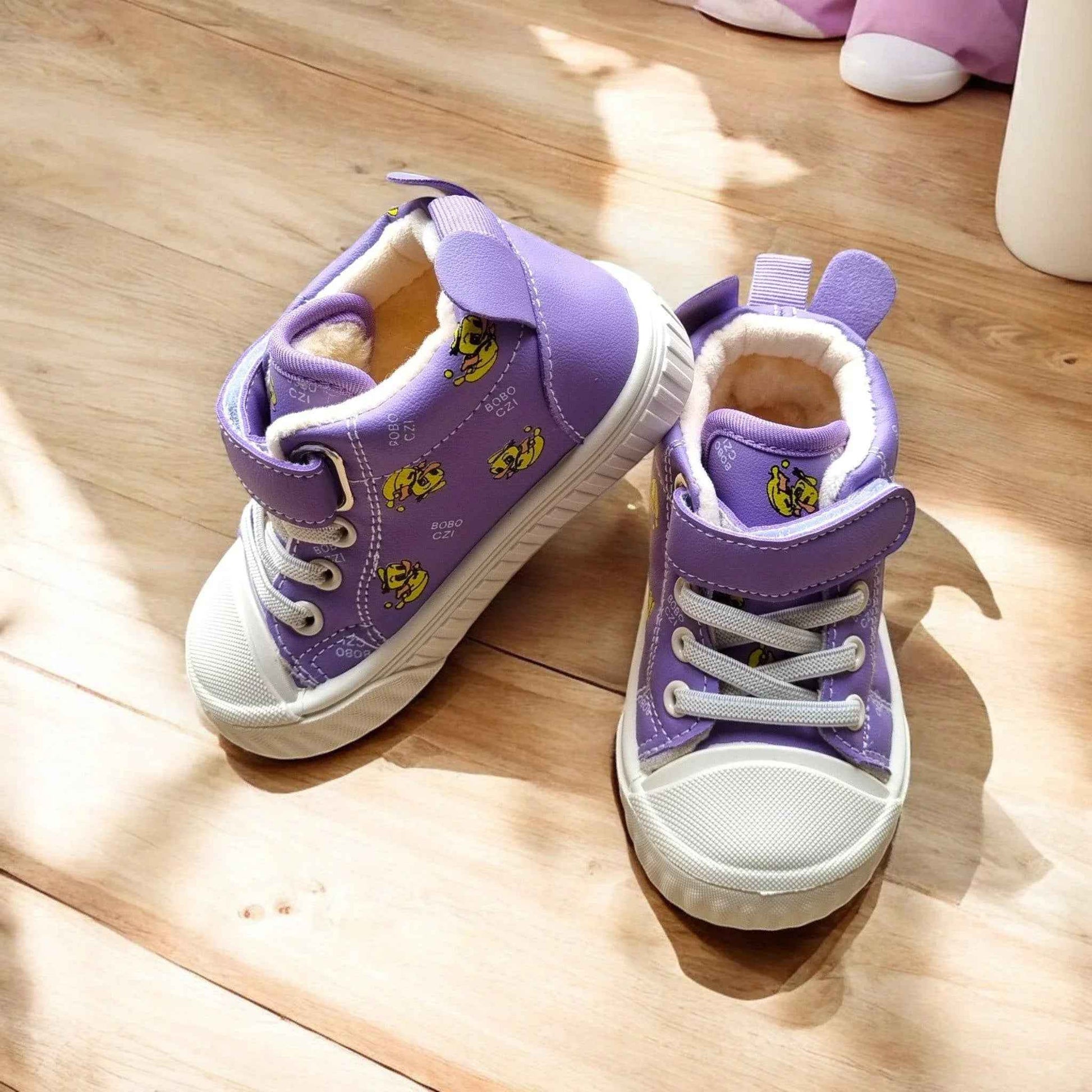 Happy Feet NZ plush high-top shoes featuring soft, secure, and playful design with colorful accents and cozy fabric.