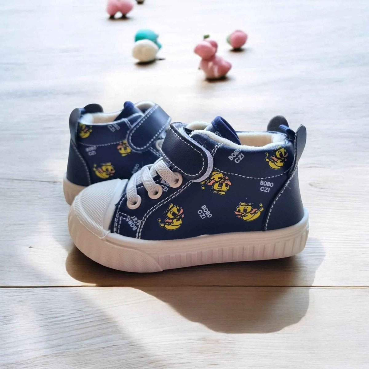 Happy Feet NZ plush high-top shoes for kids, featuring soft, secure fit and playful design in vibrant colors.
