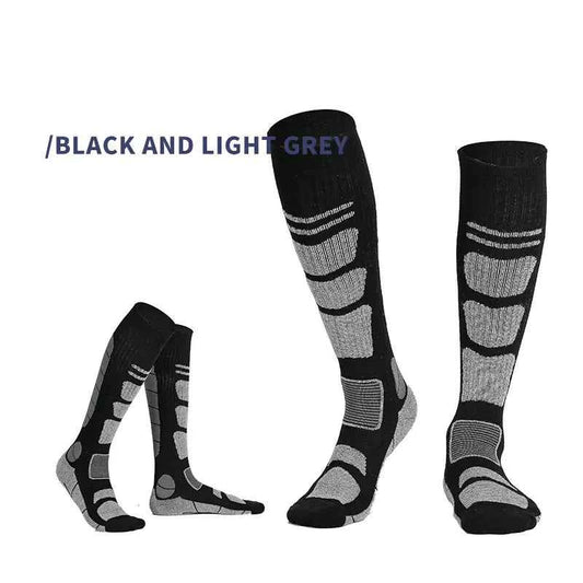 Dark grey and black over-the-knee wool hiking socks by Mead's Supply & Equipment for outdoor adventures and trail walking.