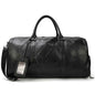 Black leather business travel bag by Mead's Supply & Equipment Outfitters, featuring multiple compartments and bronze accents.