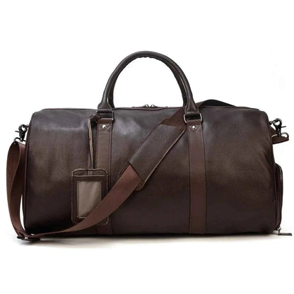 Leather business travel bag by Mead's Supply & Equipment Outfitters, black and bronze duffel with multiple compartments and sturdy handles.