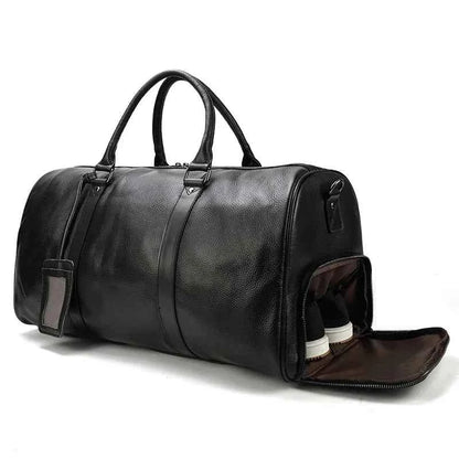 Leather business travel bag by Mead's Supply & Equipment Outfitters, black and bronze duffel with multiple compartments.