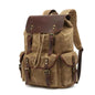Black waxed canvas computer travel bag with leather accents, Mead's Supply & Equipment Outfitters 20-35L laptop backpack for work and school.