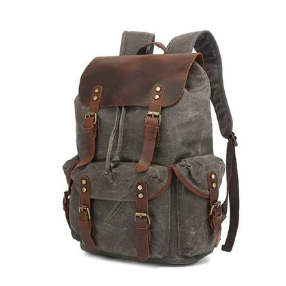 Black waxed canvas computer travel bag with leather accents, Mead's Supply & Equipment Outfitters 20-35L laptop backpack for work and school.